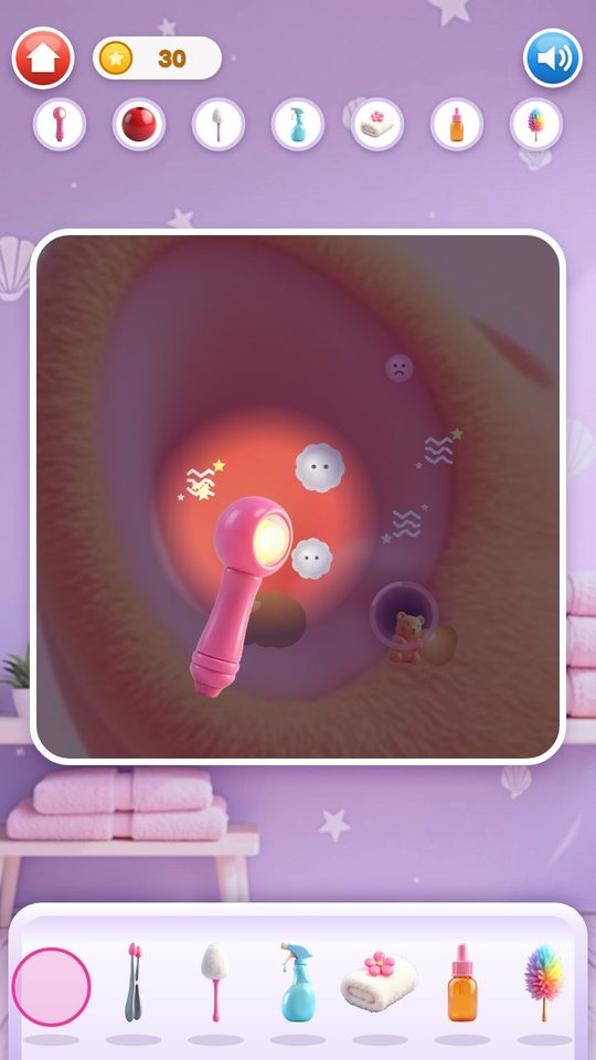 Treatment screen: the pink light shines on a darkened cat ear and shows dust bunnies, itchy spots and a gummy bear at the ear opening