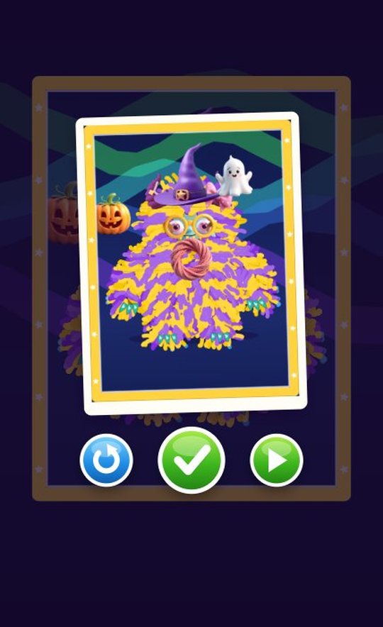 A finished photo of the striped monster in a gold frame with pumpkin and ghost stickers on an aurora backdrop